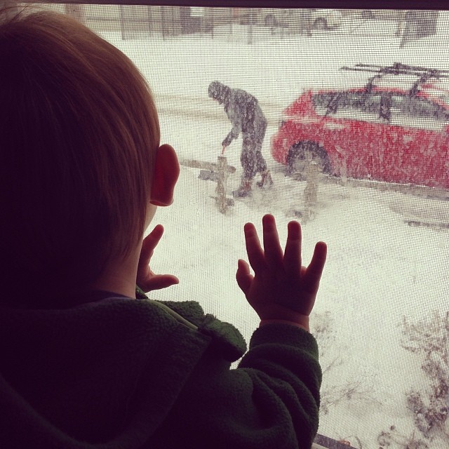 Watching papa pre-emptively shoveling snow (a few hours later it looks the same again, but we want to keep it clear in anticipation of freezing rain)